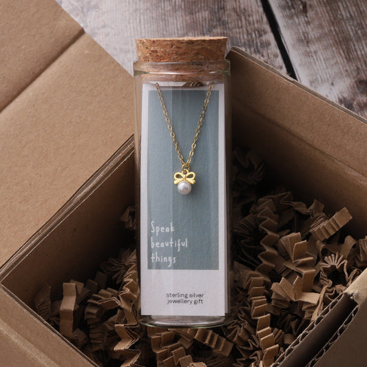 ST9002 SMALL BOW WITH PEARL NECKLACE GOLD