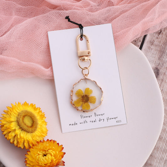 K023 Yellow buttercup Real flower in resin keyring on card