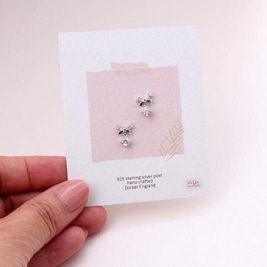 ME212 silver bow with crystal hanging earrings
