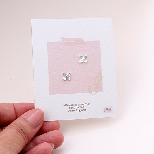 ME210 Silver four petals flower earrings