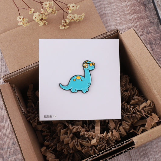 PN0174 Blue dinosaur with headphones pin